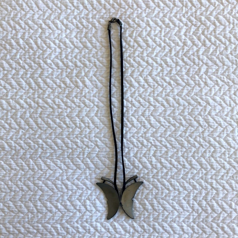 Metal butterfly necklace.